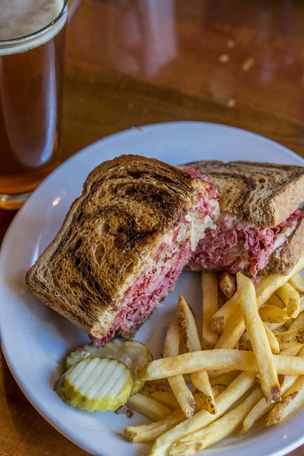 reuben-sandwich-with-french-fries-pickles-and-beer.jpg